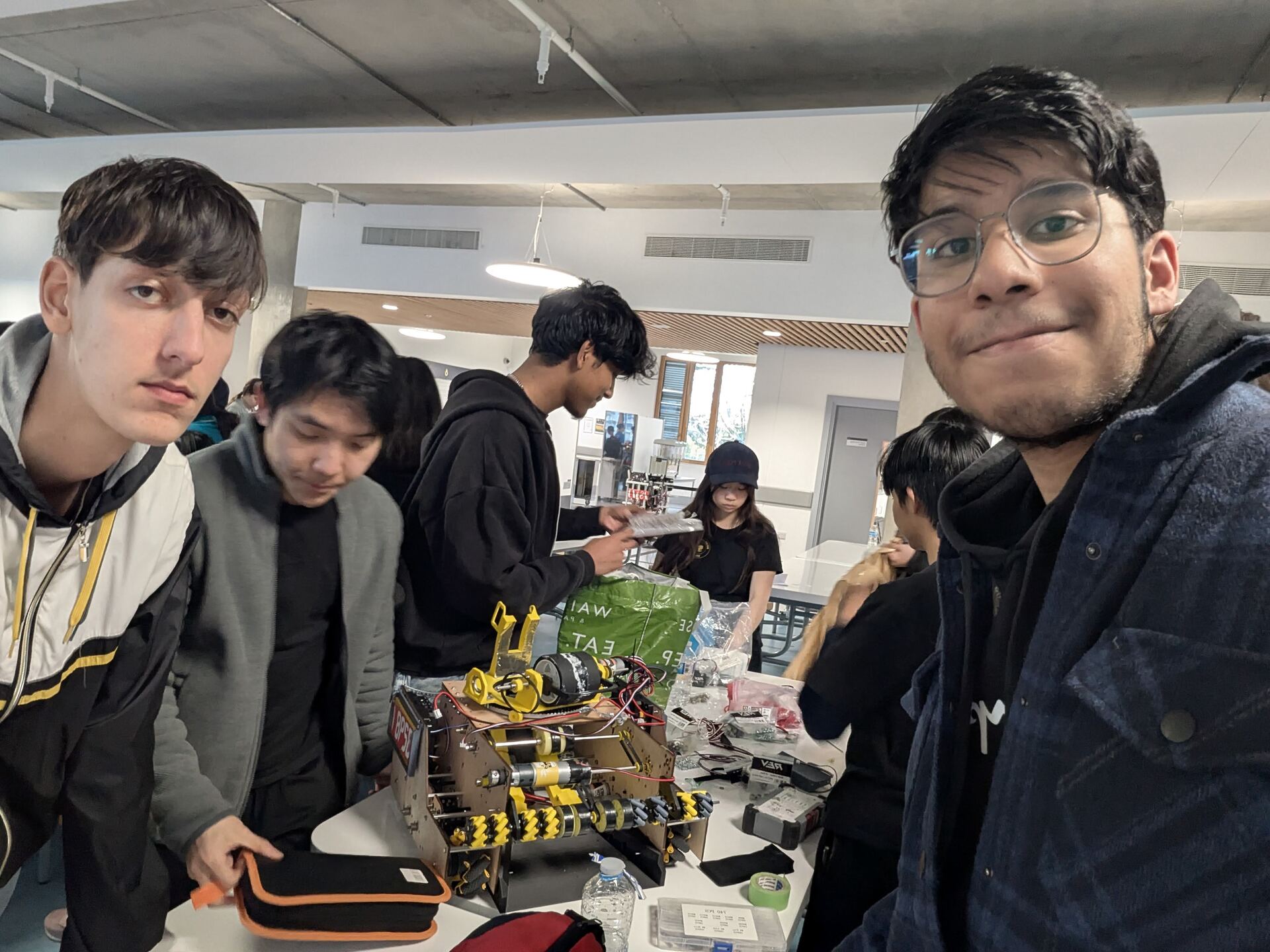 Team selfie over the robot mid-build